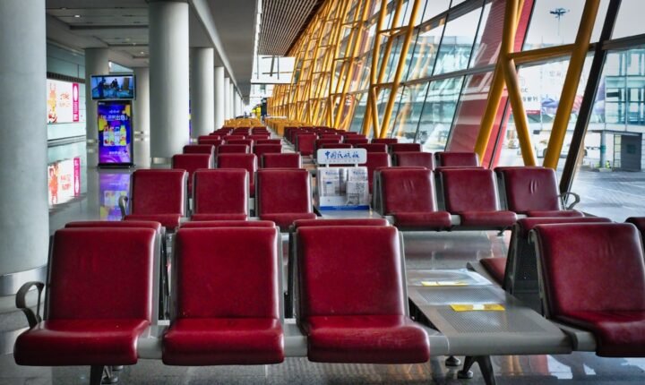 Spacious Beijing airport terminal waiting area, illustrating cross-border travel affected by new entry and exit rules