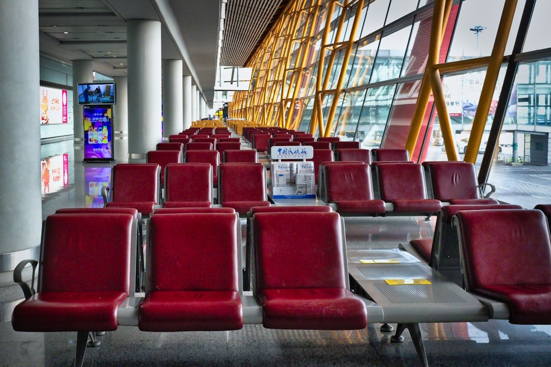 Spacious Beijing airport terminal waiting area, illustrating cross-border travel affected by new entry and exit rules