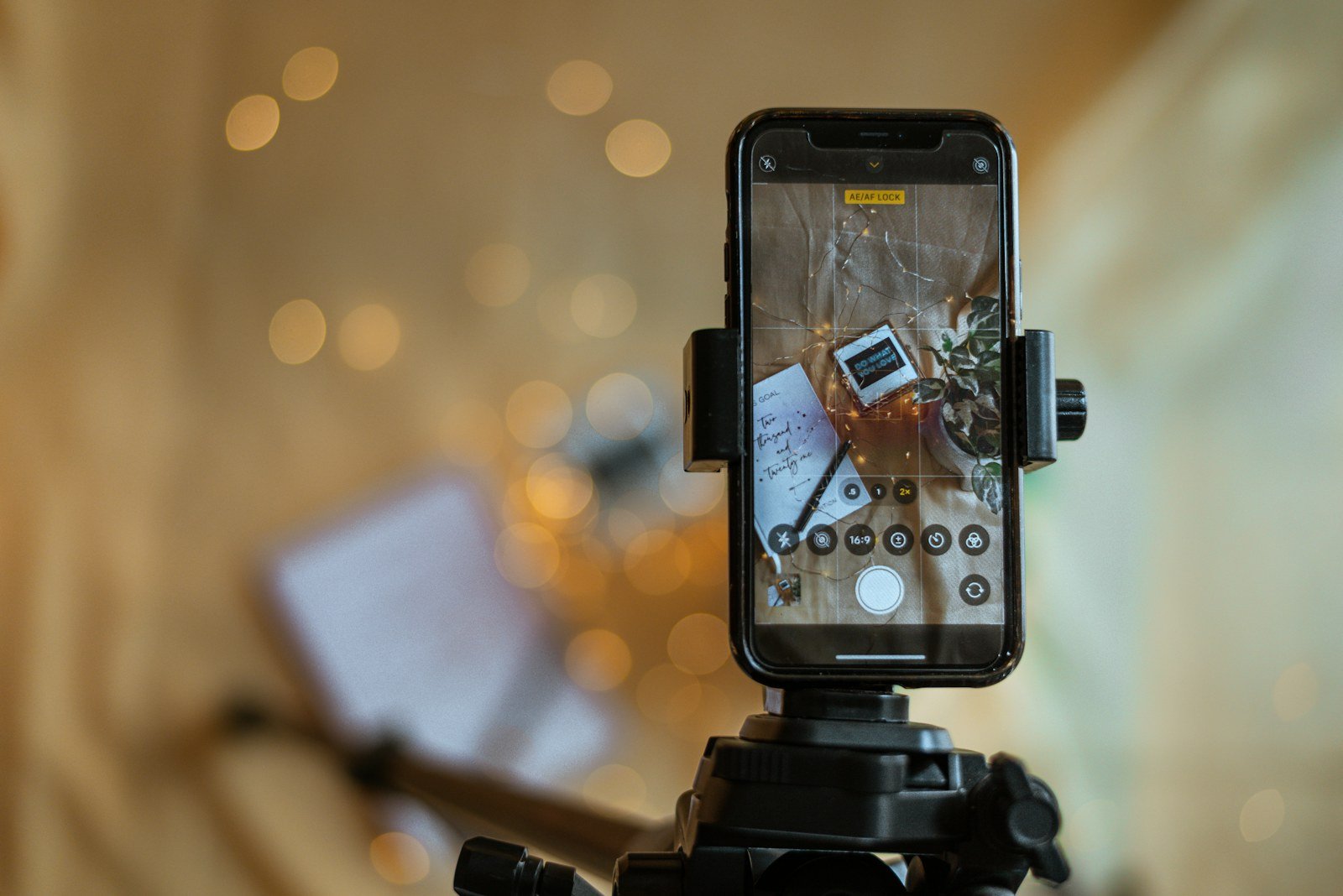 Camera, tripod and smartphone illustrating production of a YouTube Shorts series