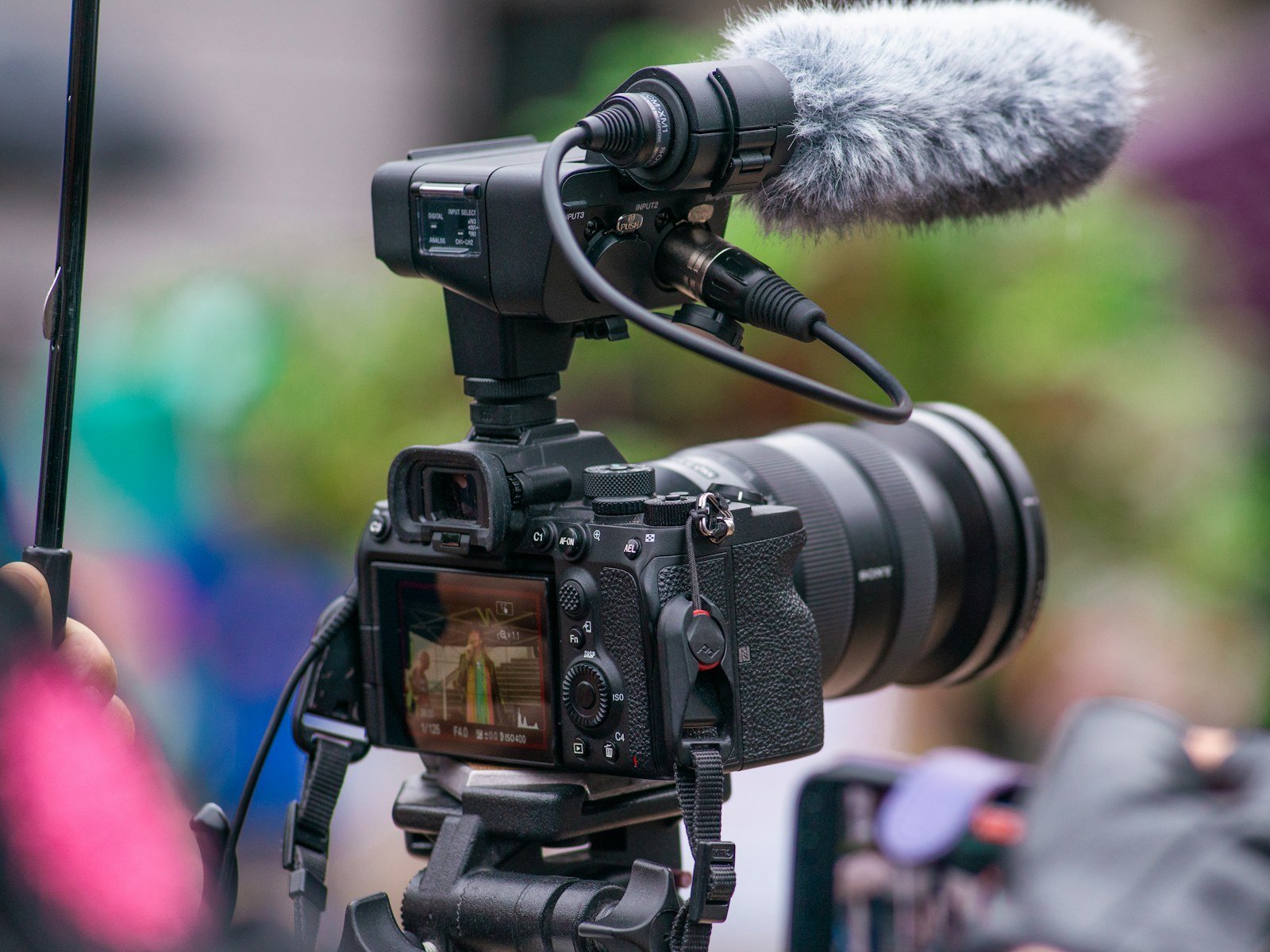 Camera recording a speaker, illustrating YouTube live-streaming tools