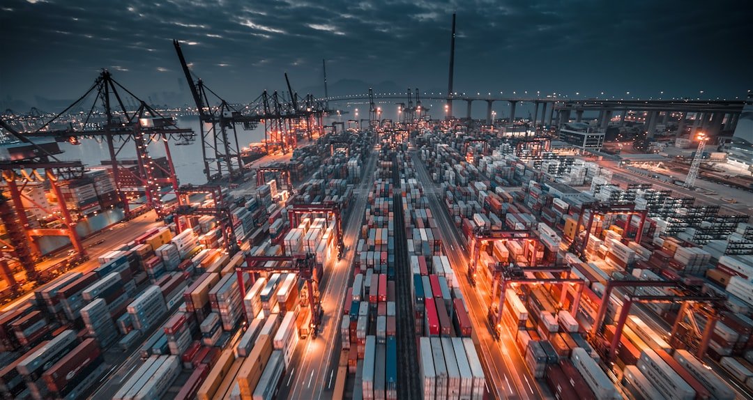 Cargo containers at a major seaport illustrating the WTO trade fragmentation warning