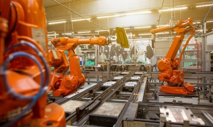 Robotic arms operating on an industrial assembly line