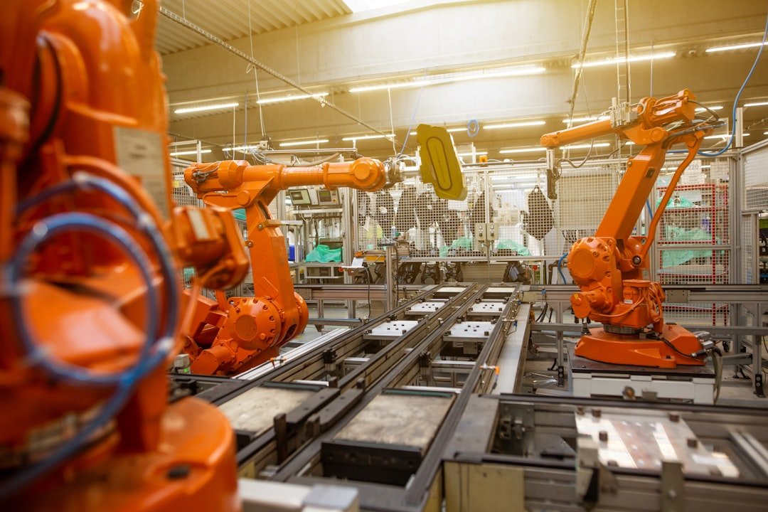 Robotic arms operating on an industrial assembly line