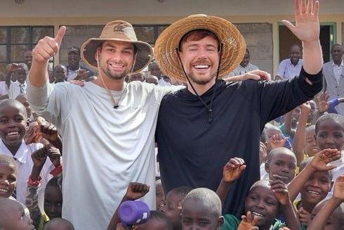 MrBeast Ghana village project photo showing MrBeast and children at the site