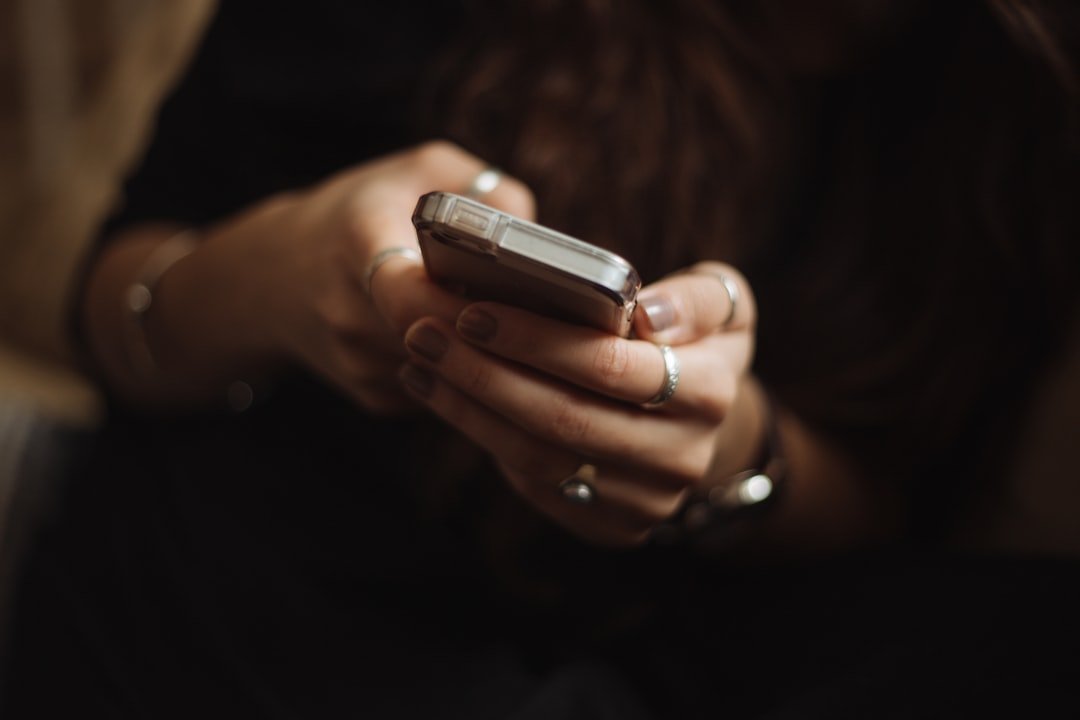 Young person using a smartphone, illustrating Australia's under-16 social media account rules