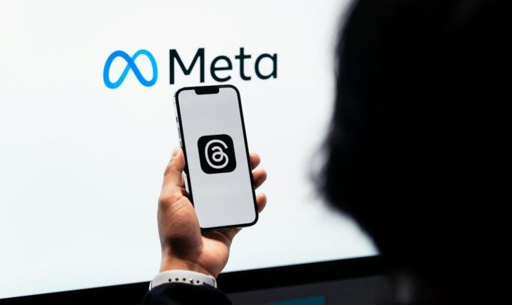 Person using the Meta Threads app on a smartphone