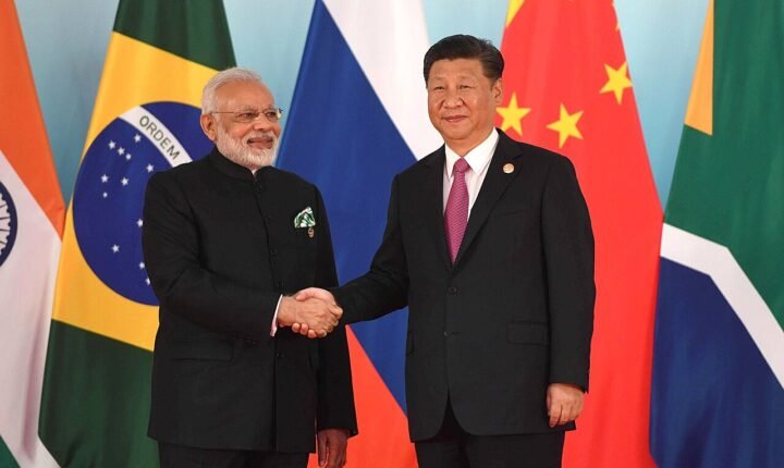 Narendra Modi and Xi Jinping shaking hands before the 2017 BRICS leaders' meeting
