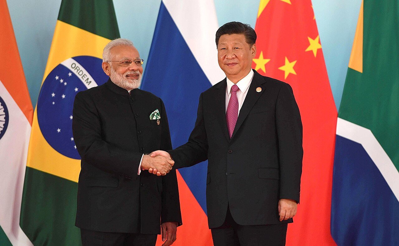 Narendra Modi and Xi Jinping shaking hands before the 2017 BRICS leaders' meeting