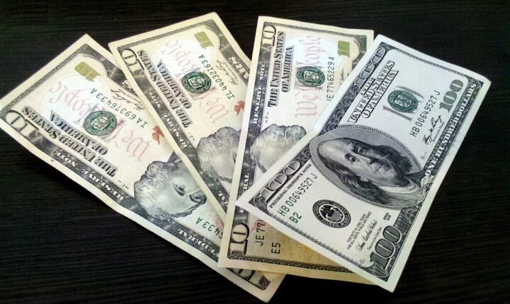 US dollar banknotes, illustrating inflation and interest-rate policy