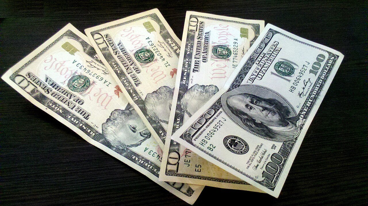 US dollar banknotes, illustrating inflation and interest-rate policy