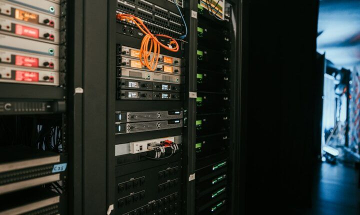 Rows of server racks in a data center, illustrating the computing infrastructure used to train and run large AI models.