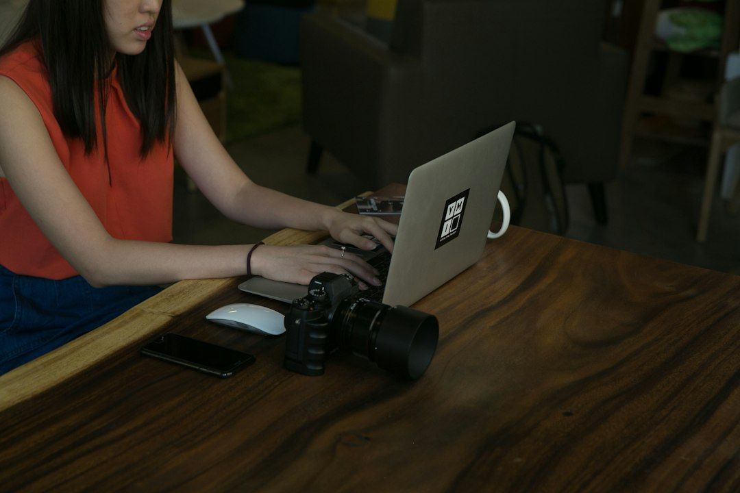 Creator at a laptop, illustrating the YouTube dislike button update