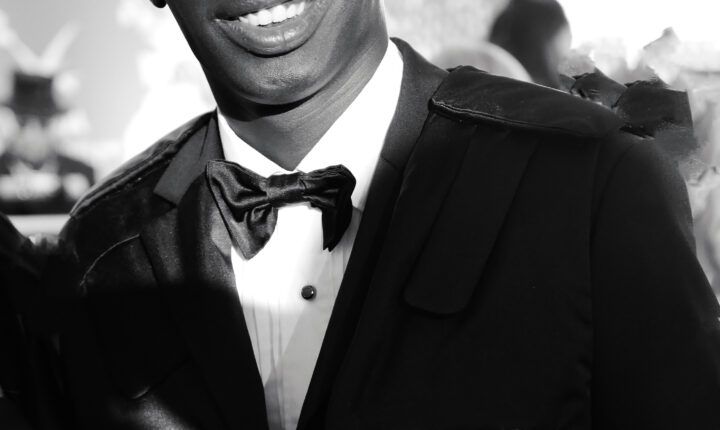 Khaby Lame wearing a dark suit at Cannes on May 18, 2022