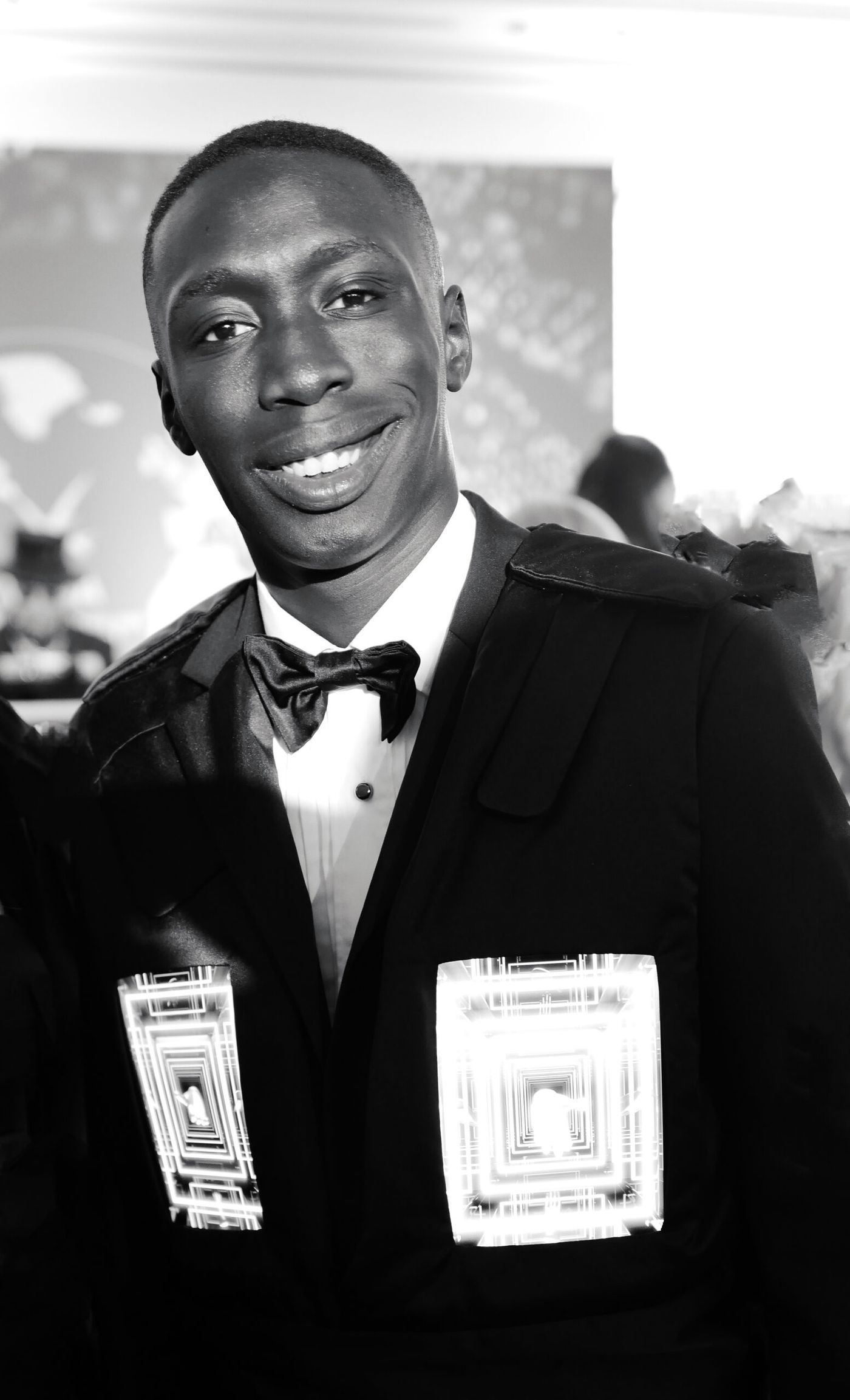 Khaby Lame wearing a dark suit at Cannes on May 18, 2022
