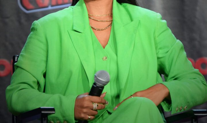 Lilly Singh holding a microphone at New York Comic Con on October 9, 2022