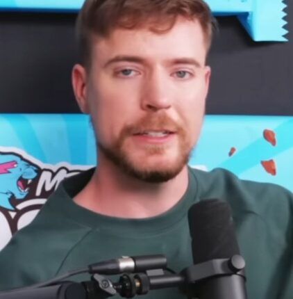 MrBeast speaking into a handheld microphone in a May 2025 video still