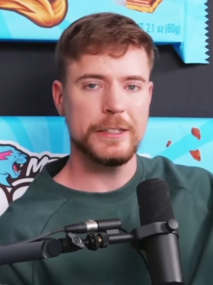 MrBeast speaking into a handheld microphone in a May 2025 video still