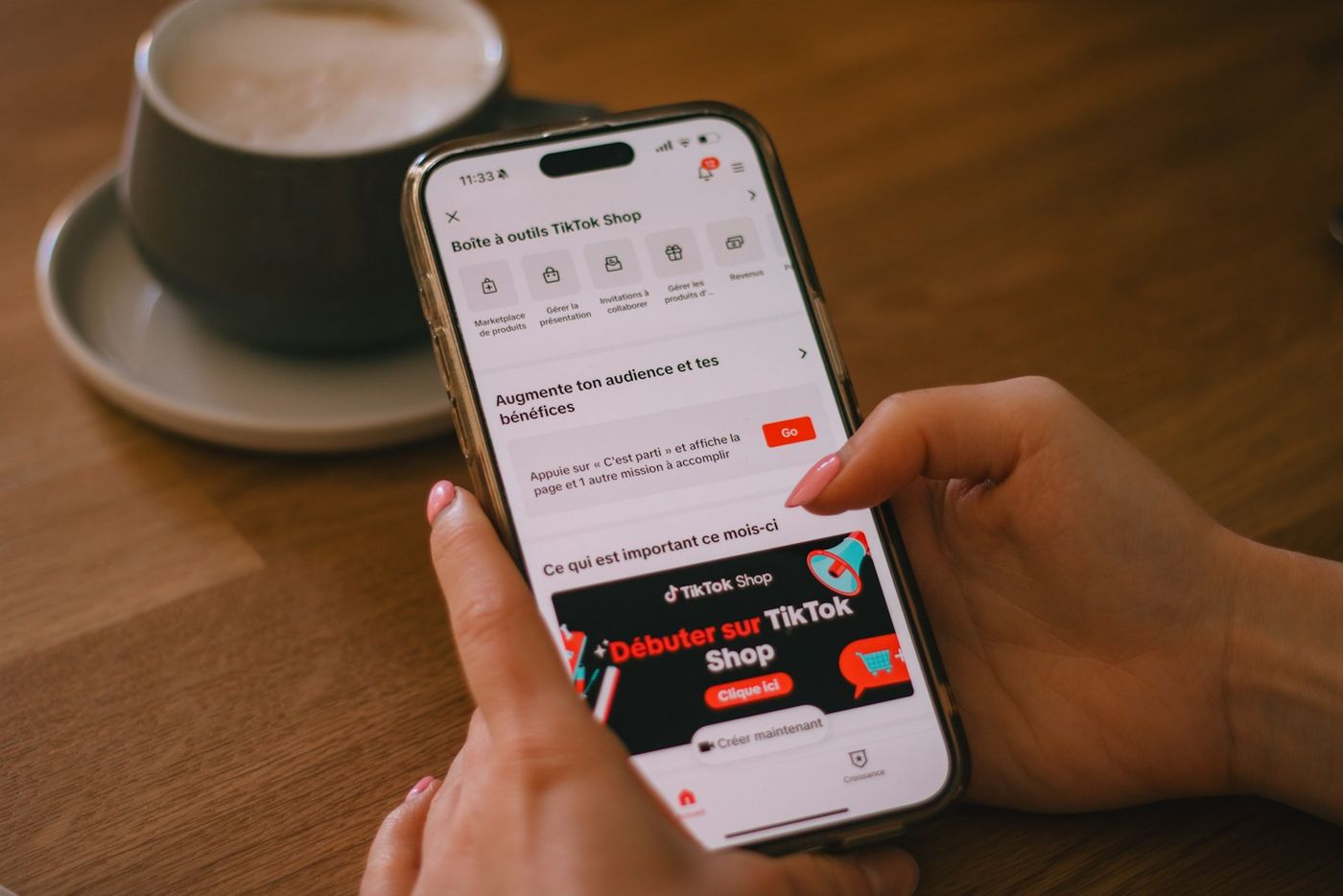 A person using a smartphone displaying TikTok Shop