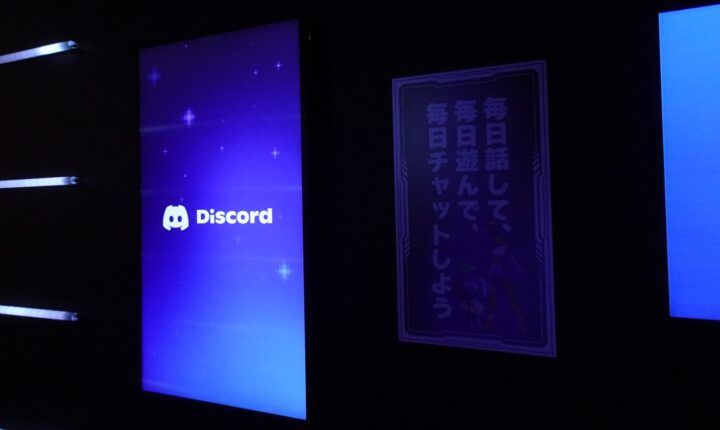 Discord logo on a screen at the Discord booth, the company behind the Discord Google search change