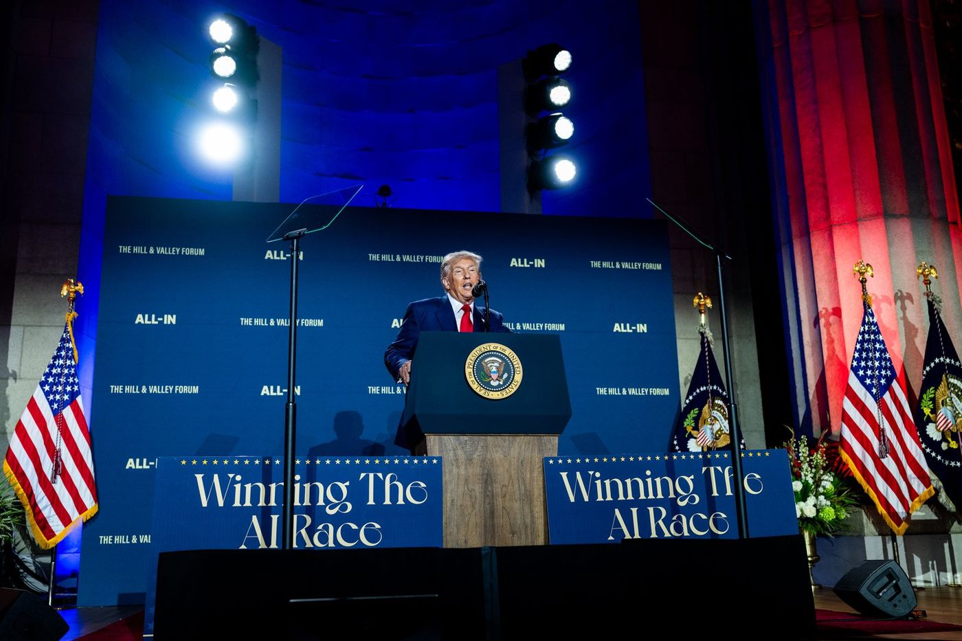 Donald Trump speaks under Winning the AI Race signs, months before his Super Intelligence order