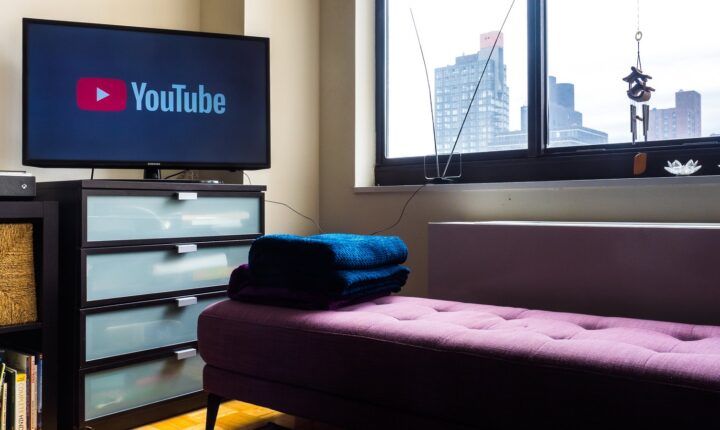 A television showing the YouTube logo in a New York living room