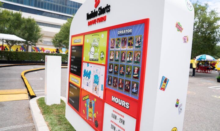 YouTube Shorts Drive-Thru sign with creator trading cards at VidCon 2022 in Anaheim
